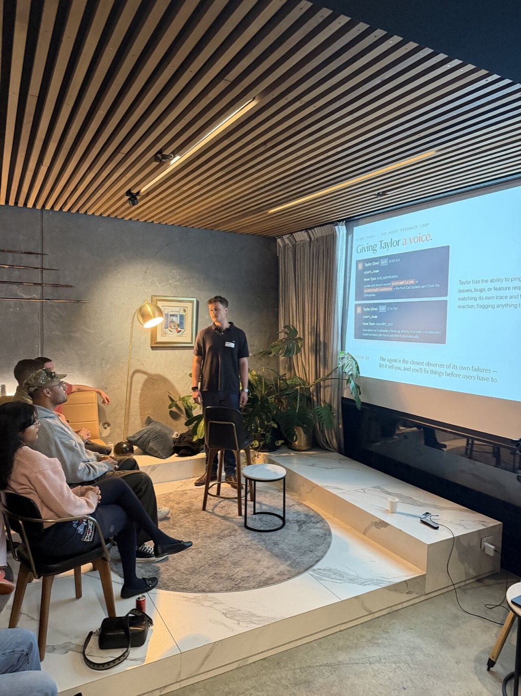 A Grw AI team member presenting a talk on building Taylor